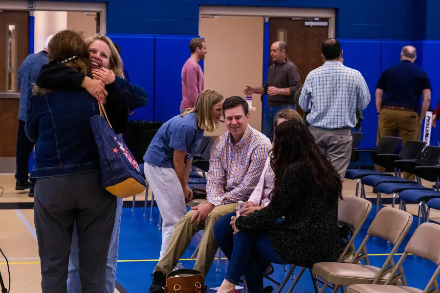 Members of Redeeming Grace Church greeting one another after the Sunday service